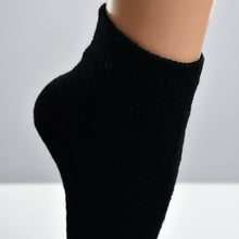 Adult socks in assorted designs and colors.